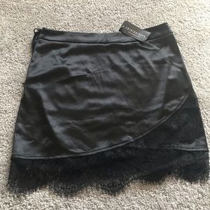 NWT Fashion Nova black satin skirt w/ lace detail